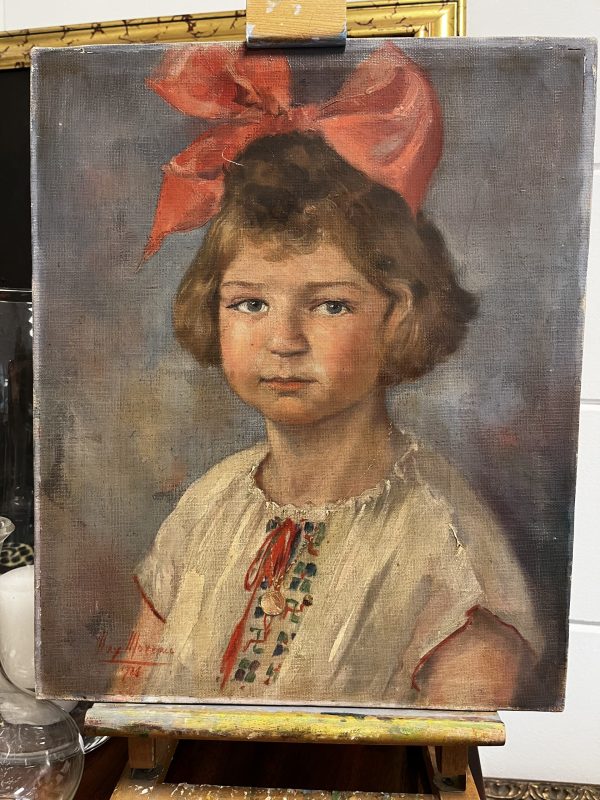 Meisje met rode strik